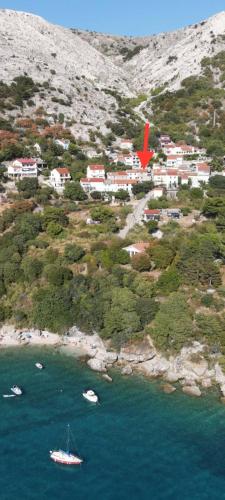 a group of boats in a body of water at House Franulich in Stara Baška