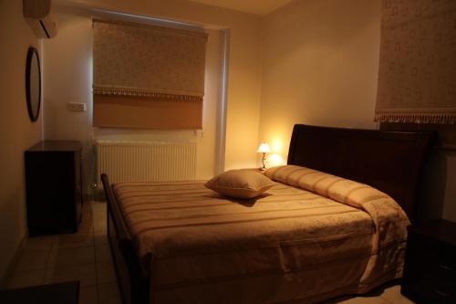 Una cama o camas en una habitación de Vengera Suites
