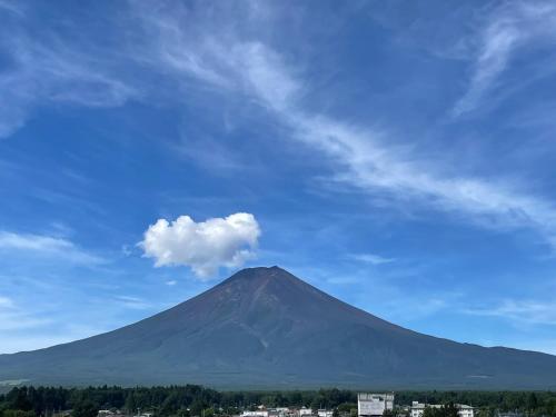 a mountain under a blue sky with a cloud at Hotel Fuyokaku - Vacation STAY 13467v in Fujiyoshida
