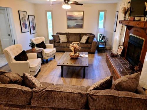 a living room with a couch and a fireplace at Judy House in Hammond