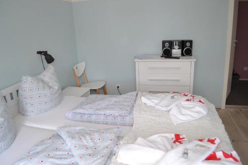 a bedroom with a bed with towels on it at Wassersportzentrum Alte Feuerwache in Brandenburg an der Havel