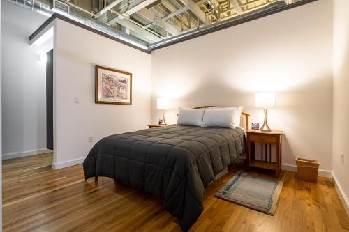 a bedroom with a bed in a room at The Press Loft in Asheville
