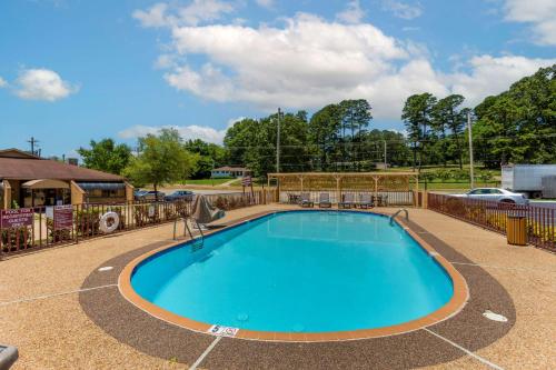 a swimming pool with a fence around it at Best Western Benton Inn in Benton