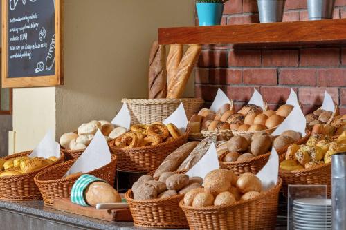 a bunch of baskets filled with different types of bread at Radisson Blu Resort El Quseir in Quseir