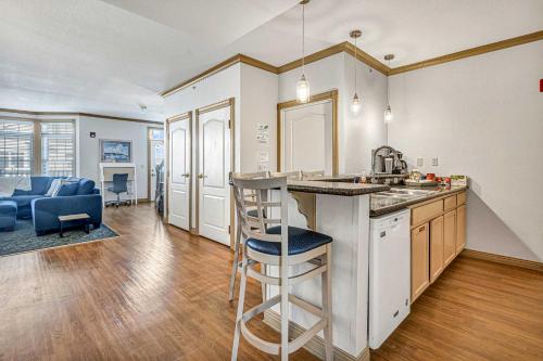 a kitchen and living room with a sink and a counter at Beautiful Day Getaway - Lake Michigan Views in Sheboygan