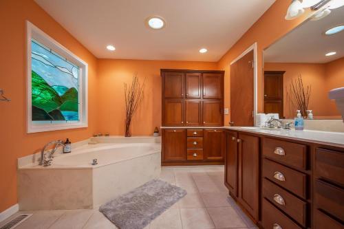 a large bathroom with a tub and a sink at Lake Al'Lure in Lake Lure