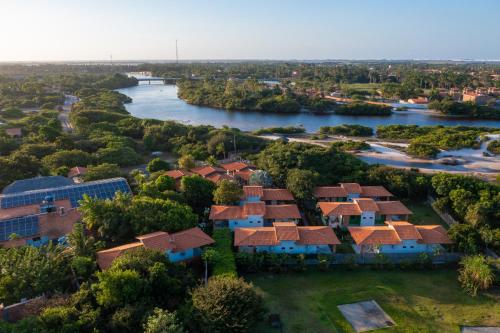 an aerial view of a house with a river at Hotel Pousada Rancho das Dunas in Santo Amaro