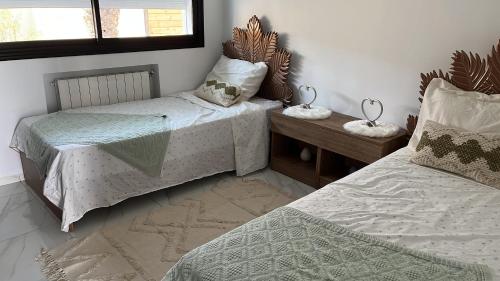 Postel nebo postele na pokoji v ubytování Villa Dar lynoute