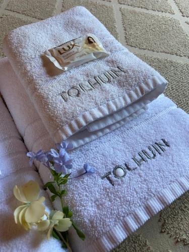 a couple of towels with flowers on top of them at TOLHUIN COLON in Colón