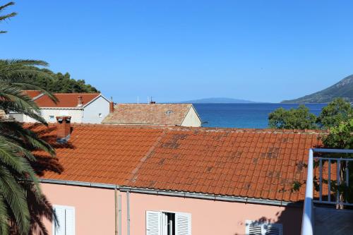 a view of the roofs of a building at Studio Zuljana 4576c in Žuljana