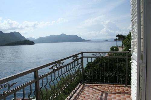 a balcony with a view of a body of water at Apartments and rooms by the sea Trstenik, Peljesac - 4566 in Trstenik