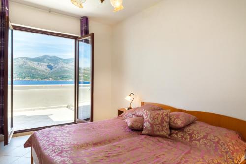 Posteľ alebo postele v izbe v ubytovaní Apartments by the sea Tri Zala, Korcula - 4346