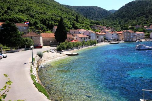 a view of a river with buildings and a town at Apartments and rooms by the sea Racisce, Korcula - 4341 in Račišće