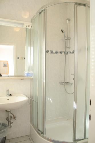 a bathroom with a shower and a sink at Apartments and rooms by the sea Korcula - 4356 in Korčula
