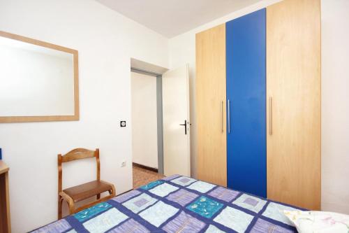 Posteľ alebo postele v izbe v ubytovaní Apartment Lumbarda 4440a
