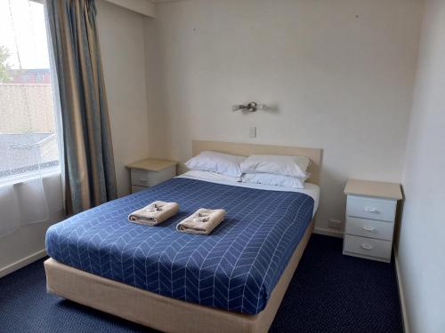 Ένα ή περισσότερα κρεβάτια σε δωμάτιο στο Heyfield Motel and Apartments
