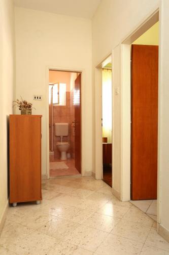 an empty room with a bathroom with a toilet at Apartments by the sea Orebic, Peljesac - 4509 in Orebić