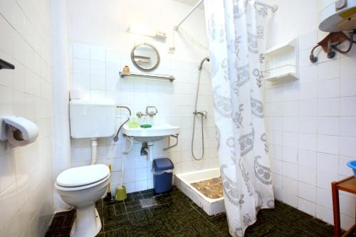 a bathroom with a toilet and a sink at Seaside holiday house Orebic, Peljesac - 4569 in Orebić