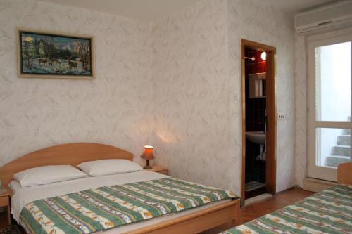 Postel nebo postele na pokoji v ubytování Apartments and rooms by the sea Orebic, Peljesac - 4553
