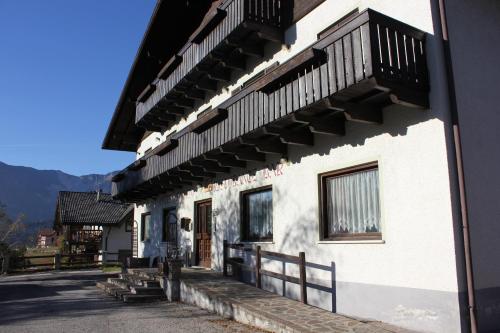 a building with balconies on the side of it at Hotel Mignon in Folgaria