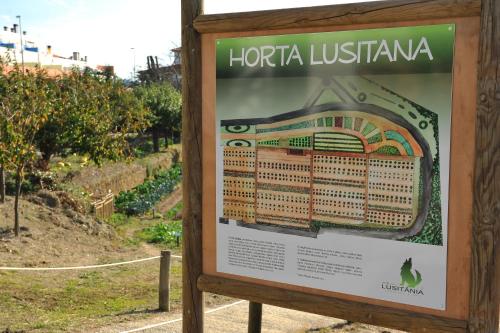 a sign for the horta justinianarmaarmaarmaastery at Hotel Lusitania Congress & Spa in Guarda