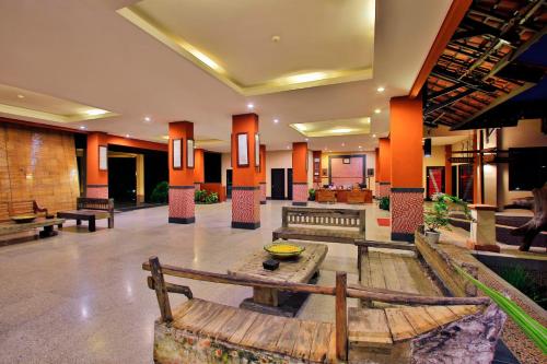a lobby with a bench in the middle of it at The Jayakarta Suites Komodo Flores in Labuan Bajo