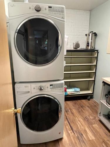 a washer and dryer stacked on top of each other at All the Waters Retro Home on Lake Michigan- Your Own PRIVATE BEACH in Benton Harbor