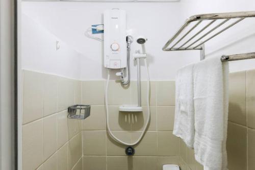 a shower in a bathroom with a shower at 2BR Condo in Tagaytay I Lake View I Fast Wifi I Free Parking in Tagaytay