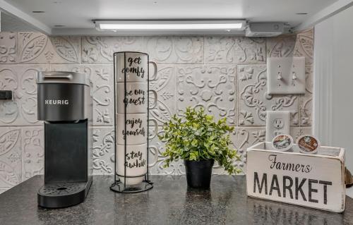 a store with a coffee maker on a counter at The Blue Diamond Retreat in Brenham