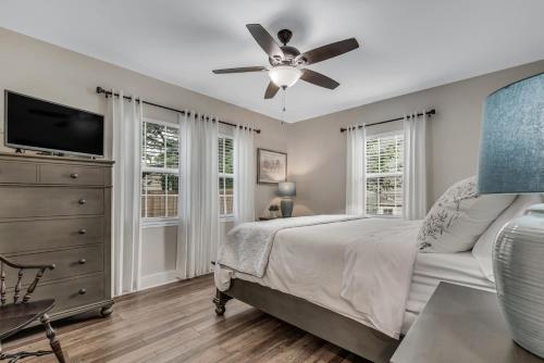 a bedroom with a bed and a ceiling fan at The Blue Diamond Retreat in Brenham