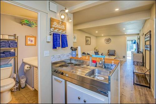 a kitchen with a sink and a toilet at Sea Star Condo in Ocean Shores