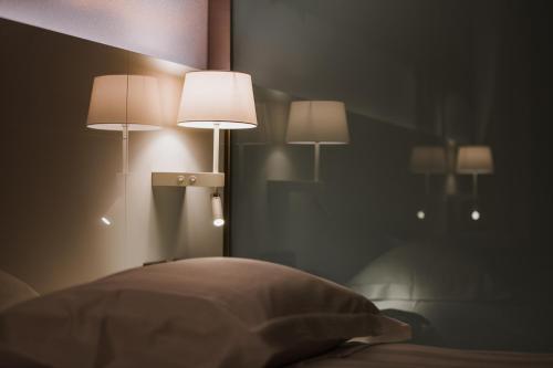 Letto o letti in una camera di Life Hotel