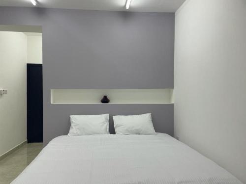 Кровать или кровати в номере Maan Hotel Apartment