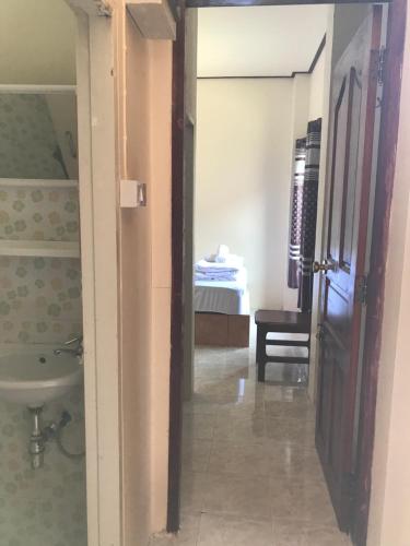 a bathroom with a sink and a toilet at Baan Aomsin in Chiang Khan