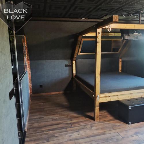 a bunk bed in a small room with at Love Apartmanok Eger in Eger
