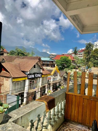 a view of a city from the balcony of a building at Viet Duc Guest House in Sa Pa