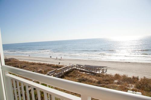 a view of the beach from the balcony of a beach house at Towers at North Myrtle Beach in Myrtle Beach