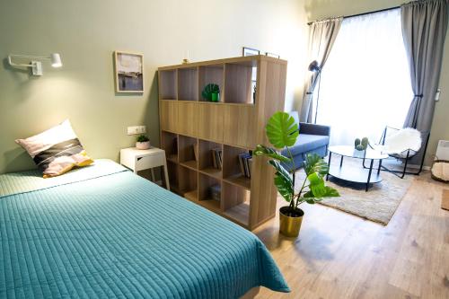 Posteľ alebo postele v izbe v ubytovaní Cozy Apartment On The Boulevard.