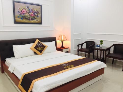 מיטה או מיטות בחדר ב-Amour Cantho Enjoy Hotel