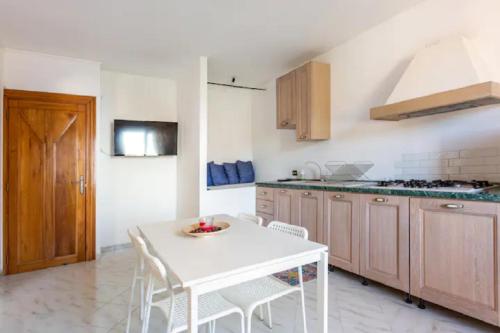 A kitchen or kitchenette at Villa Mariel Suites & Apartment