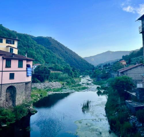 a view of a river in a town with mountains at Casa Celestine in Via Orsini Isolabona Liguria Italy Sleeps 5 in Isolabona