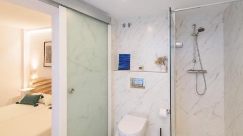 a bathroom with a shower and a toilet at Casa Antana Frigiliana by Ruralidays in Frigiliana