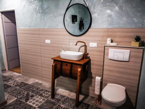 a bathroom with a sink and a toilet at L'Effet Mer, maison d'exception in Berck-sur-Mer