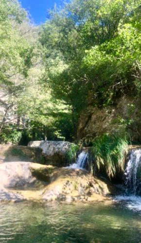 a painting of a waterfall next to a body of water at Casa Celestine in Via Orsini Isolabona Liguria Italy Sleeps 5 in Isolabona