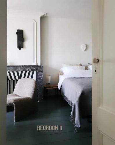 Postel nebo postele na pokoji v ubytování B&B Paradis Renee