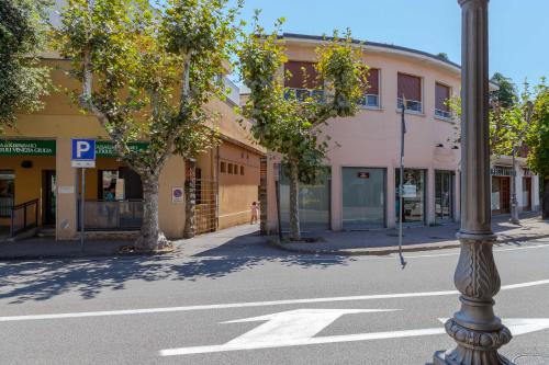 an empty street with a pole in front of a building at CasamargheRita in Muggia
