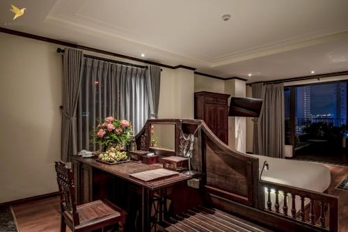 a hotel room with a desk and a mirror at Amanaki Saigon Boutique Hotel in Ho Chi Minh City