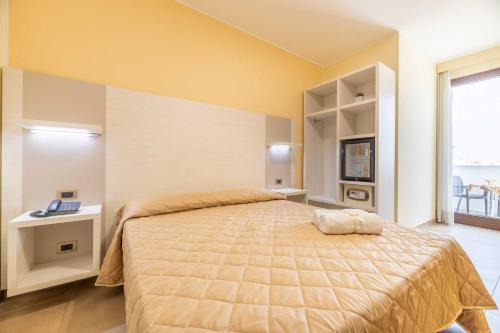 Ένα ή περισσότερα κρεβάτια σε δωμάτιο στο Hotel Salento Mirfran