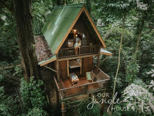 a tree house in the middle of the forest at Our Jungle House in Khao Sok National Park