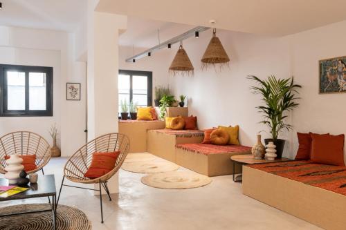 a living room filled with lots of furniture at PAME Wild in Athens
